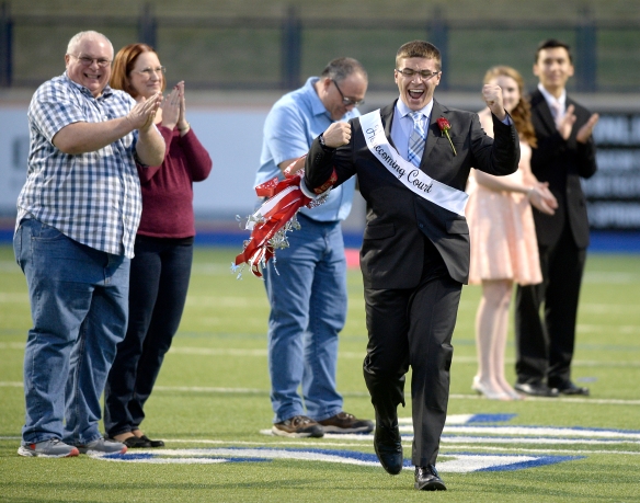 Lee High's Andrew Floyd reacts after being named homecoming king during halftime of the homecoming football game against Odessa High on Friday, Oct. 16, 2015, at Grande Communications Stadium.